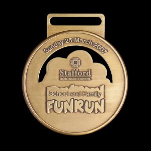 Stafford Fun Run Sports Medal - 50mm gold antique sports medal custom made for the 2007 event by Medals UK