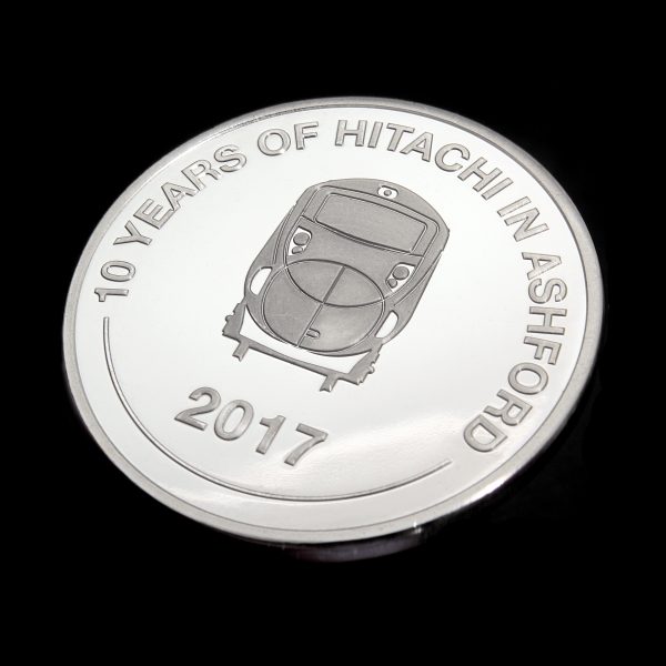 Close up of obverse of Hitachi Rail Europe coin