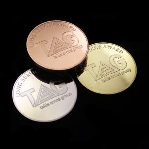 Gold Sliver and Bronze Tallis Amos Group Long Service Award Medal on black background