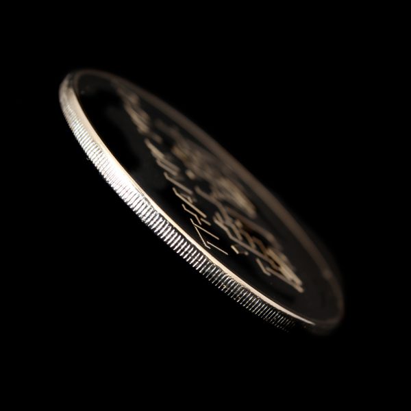 Close up of the milled edge of the AVCC Commemorative Coin for the IVCC