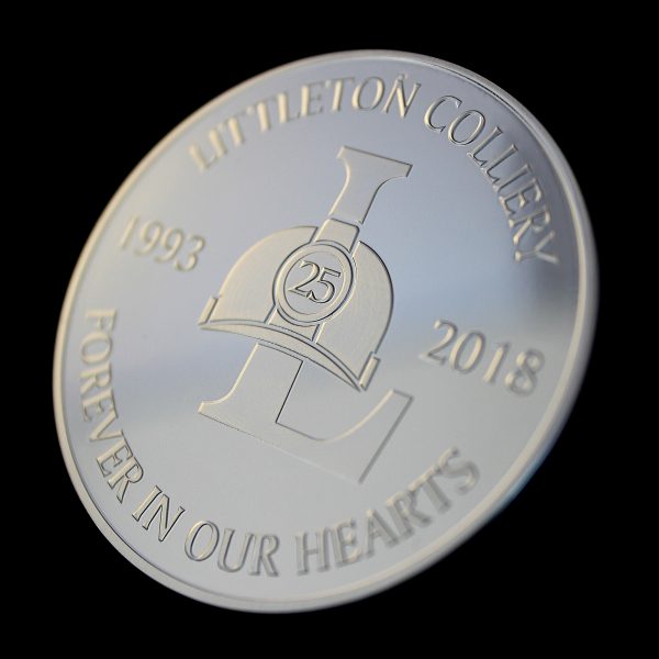 Close up of the obverse of the Littleton Colliery 25 year commemorative coin