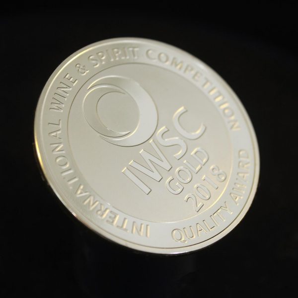 50mm Gold Semi-Proof Medal IWSC Gold quality award 2018 for The International Wine & Spirit Competition on black background