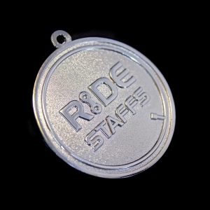 Close up of Ride Staffs Sports Pendant for Leadout Cycling Ltd on black background