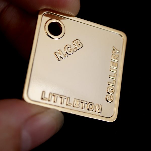 Close up of 32mm Gold Polished Mining Token 32x32 Sq NCB Littleton Colliery for Littleton Colliery Shaft Marker Group