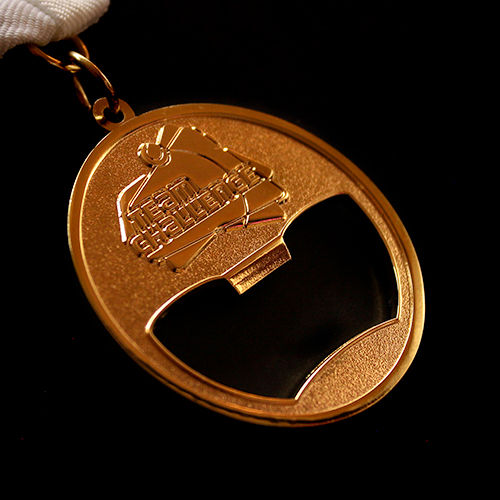 LTA Tennis Team Challenge Sports Medal is cut out cleverly and can double up as a bottle opener!