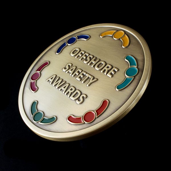 Close up of Offshore Safety Awards Medal in gold