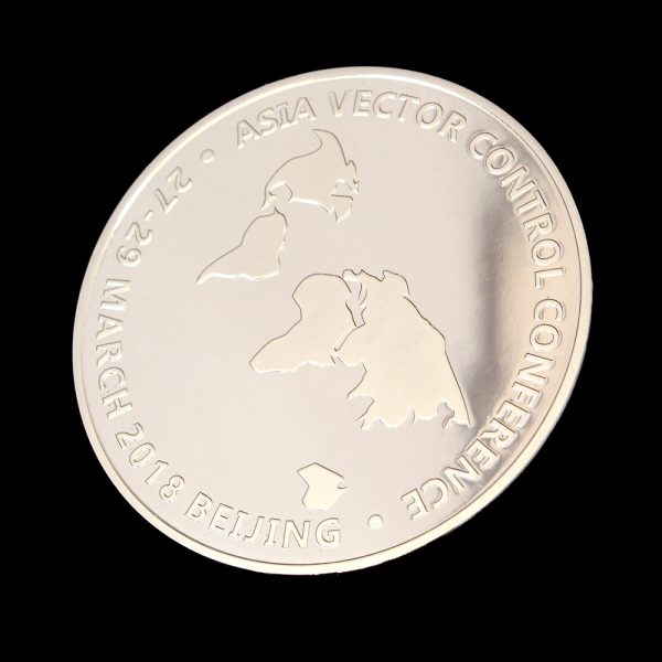 Close up obverse of the AVVC Commemorative Coin featuring map of Asia