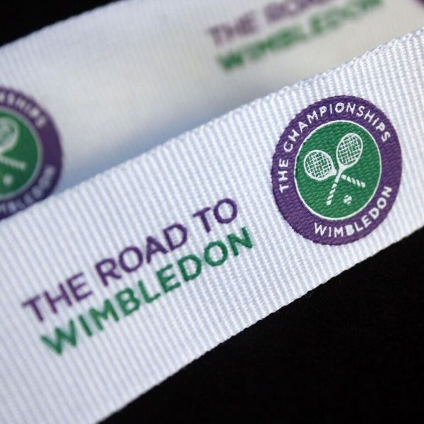 Close up of Lawn Tennis Association Road to Wimbled on Medal ribbon on black background