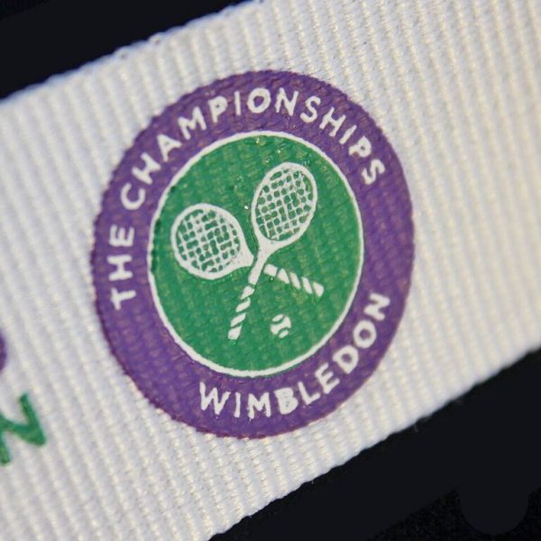 Close up of Lawn Tennis Association Road to Wimbled on Medal ribbon on black background